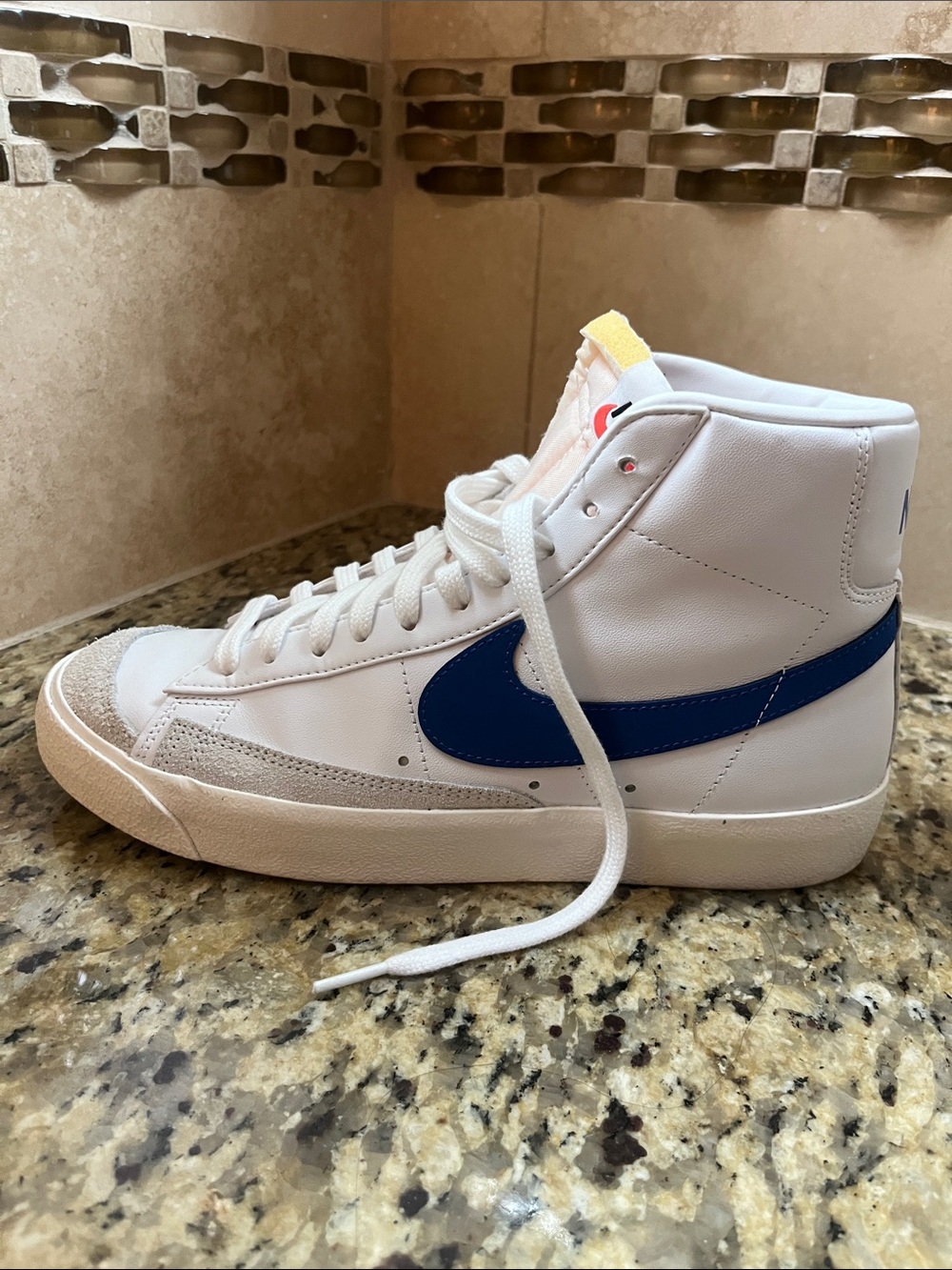Nike High-Top Sneakers in White with Blue Swoosh
